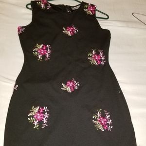 Black dress with embroidered pink flowers